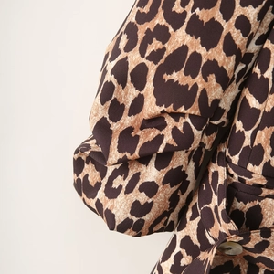 Stylish leopard print blazer with puff sleeves and waist tie for a fashionable look