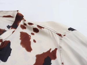 Detail view of fashion animal print shirt collar and smooth woven fabric texture