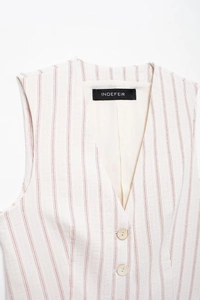 Detail of red striped vest showing V-neckline with buttons and fabric texture