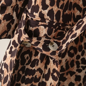 Fashionable leopard print blazer for women featuring a matching fabric belt and marble buttons