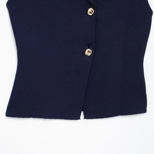 Navy blue ribbed knit vest featuring elegant gold metal buttons on a white background