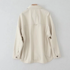 Rear view of beige washed cotton shirt jacket with back yoke and curved hem detail