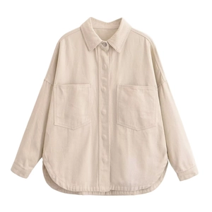 Detail of beige cotton twill shirt jacket with oversized front pockets and curved hemline