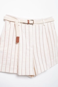 Detail of white striped shorts with red vertical lines and a braided belt with gold buckle
