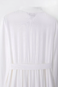Detailed back view of white linen midi shirt dress with lapel collar and waist belt