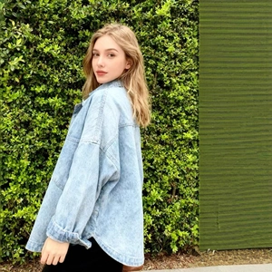 Oversized light blue washed denim jacket for women with relaxed drop shoulder fit