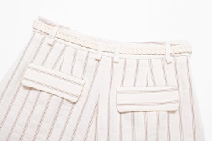 Detail of striped shorts featuring woven belt and two symmetrical back flap pockets