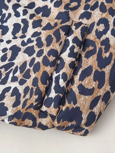 Macro view of leopard print zipper jacket showing durable fabric and slanted side pocket detail