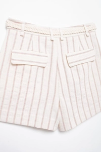 Detail of off-white striped cotton linen shorts with woven belt and flap back pockets