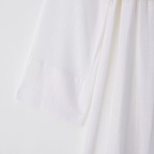 White long-sleeve cotton-linen midi shirt dress with woven texture and clean seams