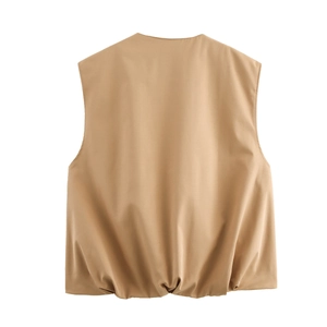 Detail view of khaki sleeveless vest back featuring premium twill fabric and pleated hemline