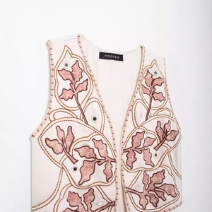 Gilet da donna crema senza maniche con ricami di foglie e dettagli con effetto specchio