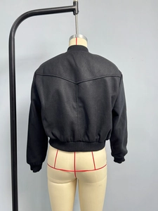 Back view of a black wool bomber jacket featuring Y-shaped stitching and ribbed trim details
