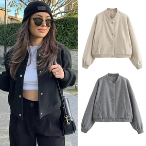 Detail view of women's soft bomber jackets in black, beige and grey textured wool fabric