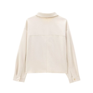 Detailed back view of a beige faux suede jacket featuring a collar and golden cuff buttons