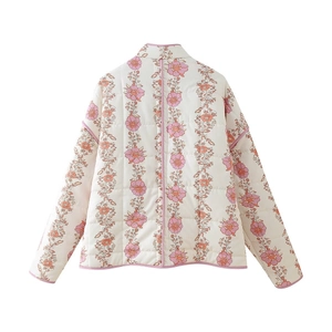 Rear view of white quilted jacket featuring pink floral stripes and piped edges