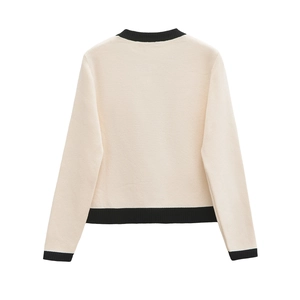 Women's knit cardigan in off-white with black contrast ribbed trim on back view
