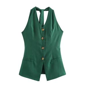 Detail of dark green halter vest with wood-texture buttons and back tie closure