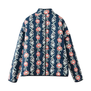 Detailed back view of women quilted jacket featuring navy base with floral pattern