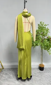 Back view of elegant backless grass green satin long dress with a matching scarf accessory