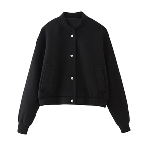 Detailed view of black cropped bomber jacket with ribbed collar and silver metal buttons
