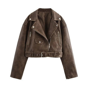 Detail of dark brown faux leather biker jacket with silver zippers and belted hem