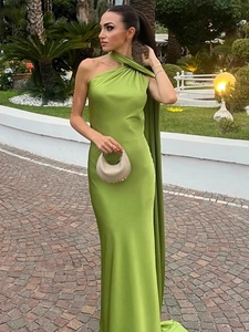 Detail of elegant backless grass green satin gown with long flowing neck scarves