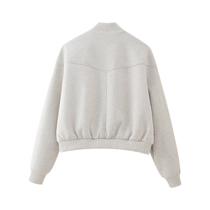 Back view of light grey oversized bomber jacket showing ribbed collar and V-seam stitching