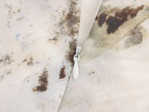 Close-up of the invisible zipper and stitching on the abstract print sleeveless dress