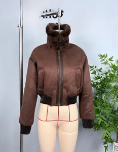 Detail of suede jacket showing faux fur collar, metal zipper, and neck strap buckle