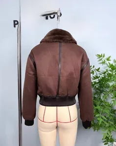 Detail view of the brown bomber jacket's back with retro faux leather piping and ribbed hem