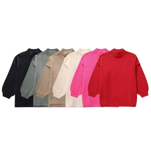 Detailed view of oversized mock neck knit sweaters in six vibrant color options