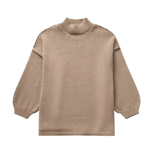 Detail view of khaki turtleneck knit sweater with ribbed cuffs and drop shoulder style