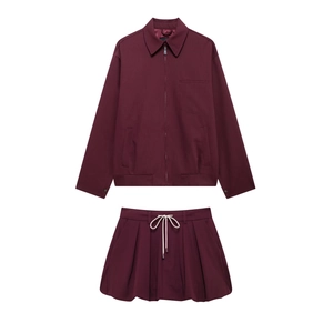 Detail of burgundy zipper jacket and bubble skirt set with contrasting drawstrings