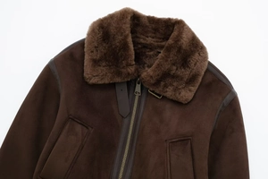 Detail of a brown suede bomber jacket featuring thick fur collar and metal zipper closure