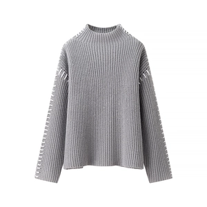 Detail of grey ribbed knit sweater with white contrast hand-stitching on the collar and sleeves
