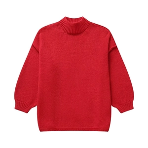 Detail of red mock neck knit sweater showing high-quality ribbed cuffs and hem texture