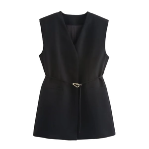 Detail of black sleeveless V-neck waistcoat with belted gold buckle and pocket flaps