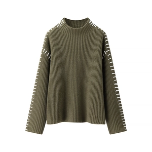 Detail of army green knit sweater showing vertical rib texture and white contrast stitching
