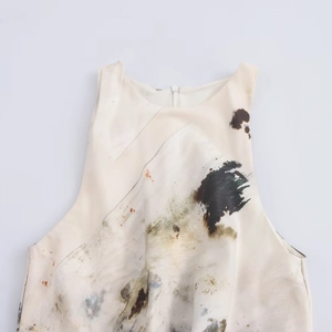 Elegant sleeveless round neck dress with artistic ink painting print on off-white fabric
