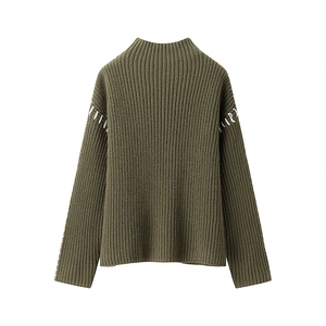 Detailed shot of army green ribbed knit sweater featuring contrast white stitching on sleeves
