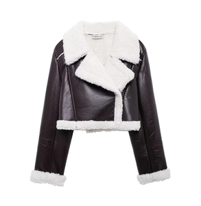 Detail of faux leather texture and white sherpa lining on a brown cropped jacket