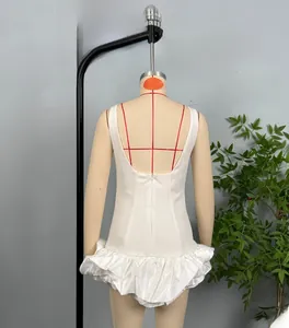 Detailed back view of white sleeveless backless mini dress with ruffled puff hemline