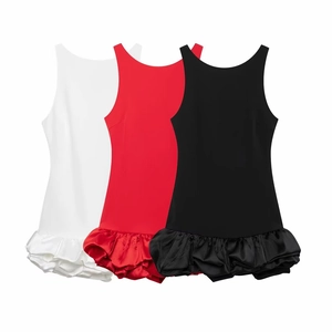 Detailed view of layered ruffled hems on sleeveless dresses in white, red, and black
