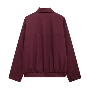 Detail of burgundy jacket back featuring turn-down collar, adjustable cuffs and elastic hem