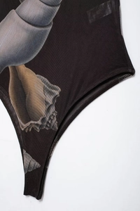Detail of breathable black mesh bodysuit featuring realistic seashell prints and high cut leg