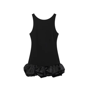 Detail of a black sleeveless mini dress featuring a pleated bubble hem and high neck