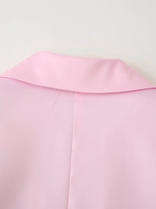Detail shot of light pink satin suit jacket back collar with smooth stitching textures