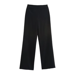 Detailed view of high-waist black wide-leg trousers featuring seamless waist design
