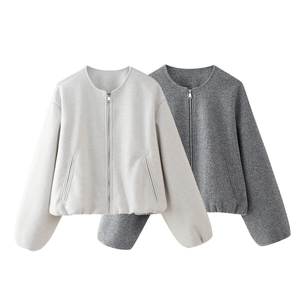 Detailed macro view of minimalist casual jackets featuring silver zippers and side pockets